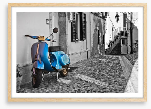 Moped in cobblestone alley, Italy