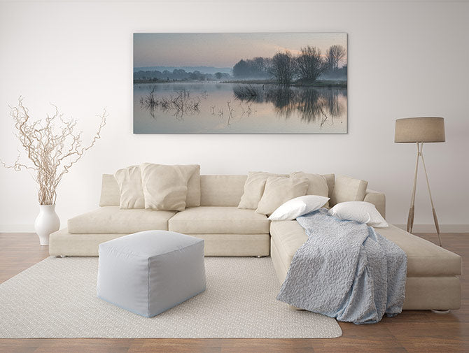 Sunrise glow over misty lake