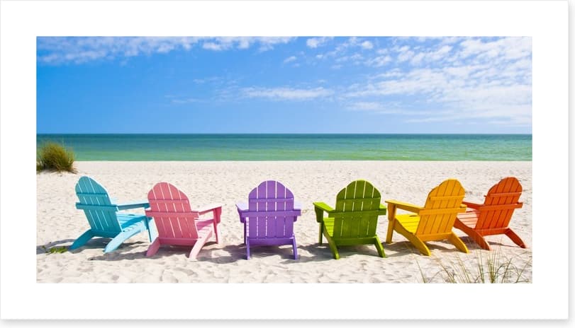Rainbow chairs on a sunny beach