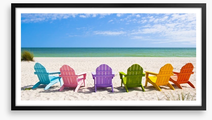 Rainbow chairs on a sunny beach