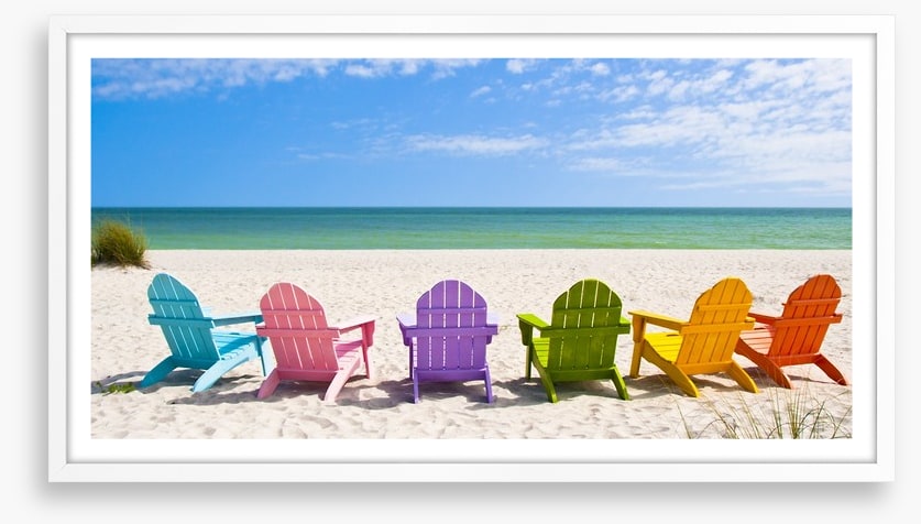 Rainbow chairs on a sunny beach