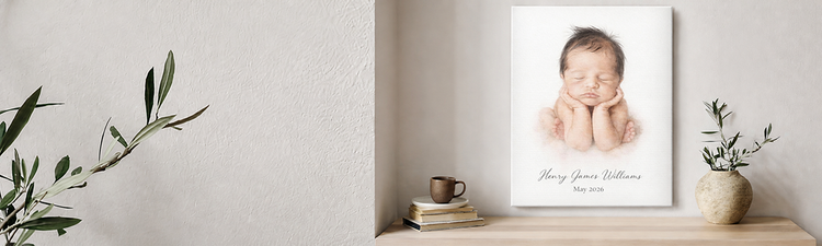 Canvas hanging on wall with baby portrait photo