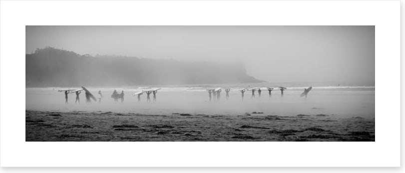 Surfers in the mist