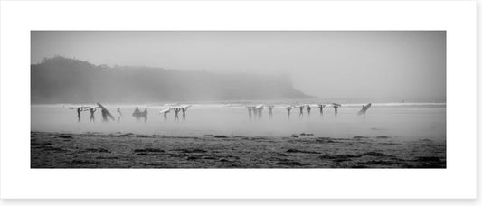 Surfers in the mist