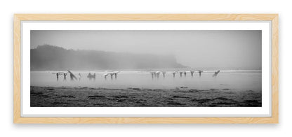 Surfers in the mist