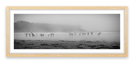 Surfers in the mist