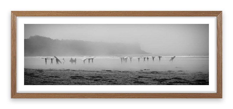 Surfers in the mist