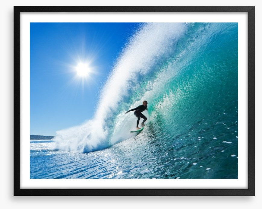 Surfer on blue ocean wave