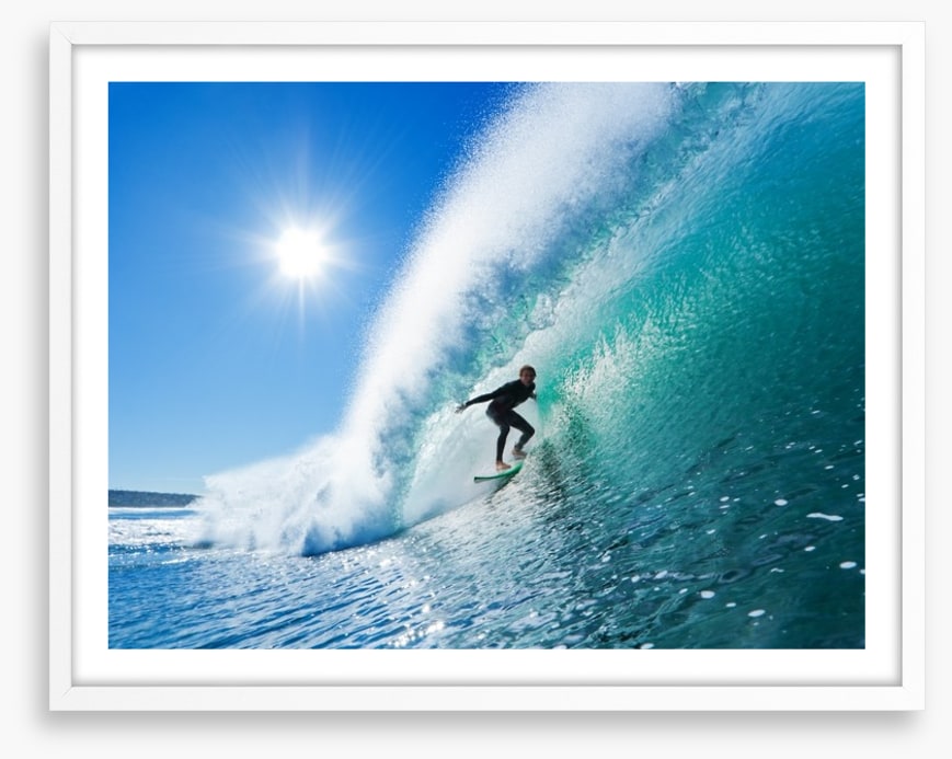 Surfer on blue ocean wave