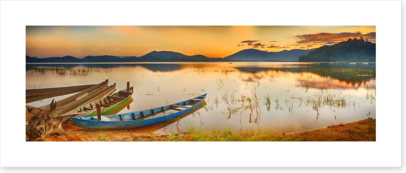 Rowing boats at sundown