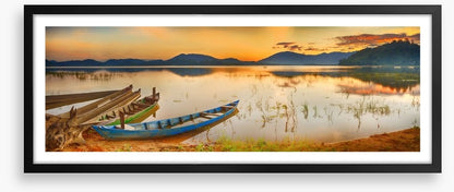 Rowing boats at sundown