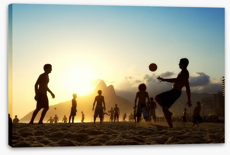 Beach football at sunset, Brazil