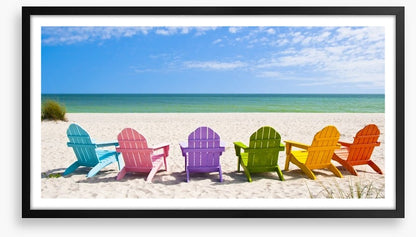 Rainbow chairs on a sunny beach