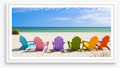 Rainbow chairs on a sunny beach