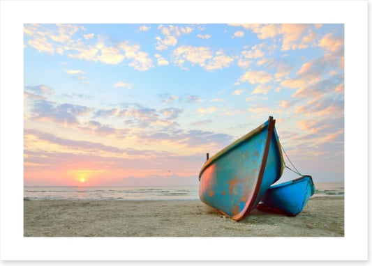 Blue boats at sunrise