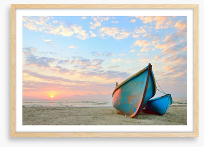 Blue boats at sunrise