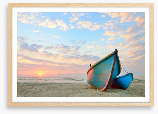 Blue boats at sunrise