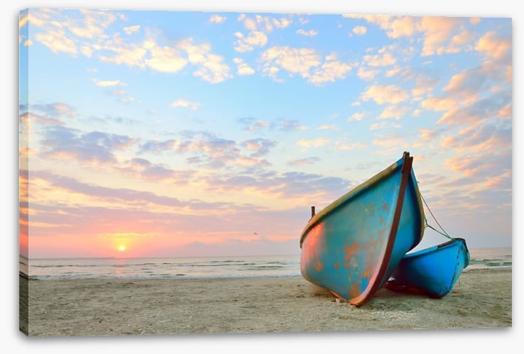 Blue boats at sunrise