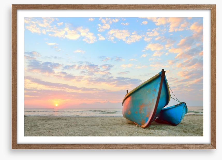 Blue boats at sunrise