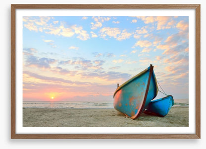 Blue boats at sunrise