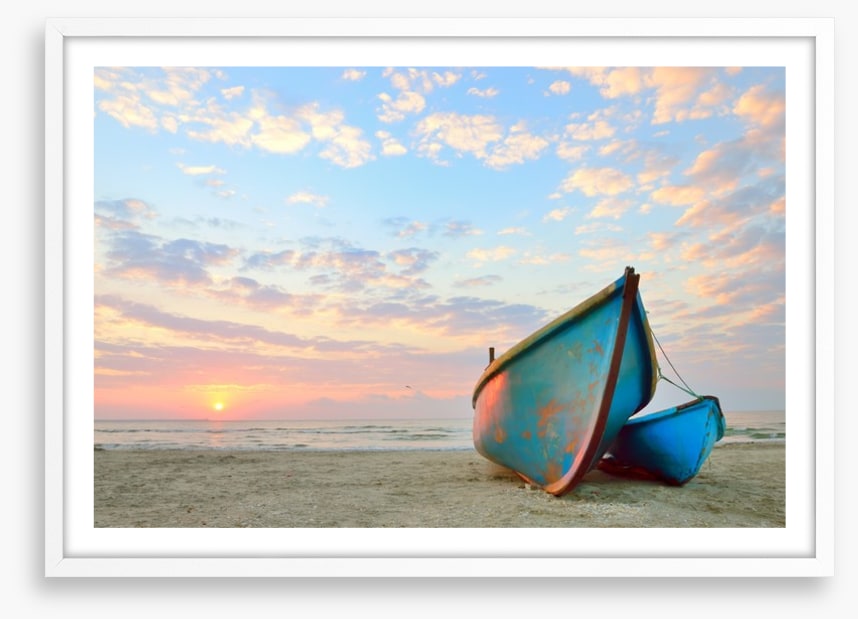 Blue boats at sunrise