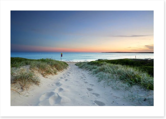 Sandy beach trail at sundown