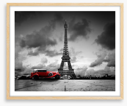 The Eiffel Tower and red car
