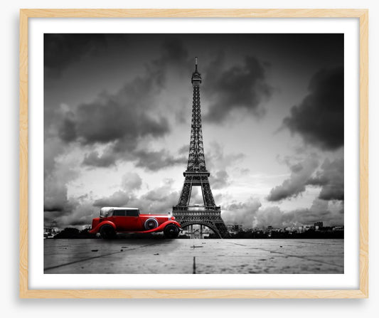 The Eiffel Tower and red car