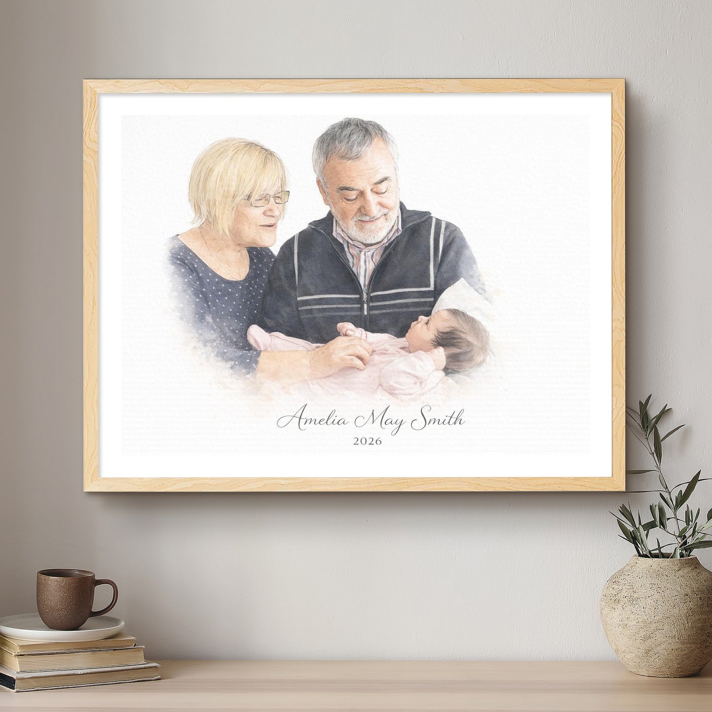 Framed artwork of a family holding a baby on a wall above a shelf with decor items.