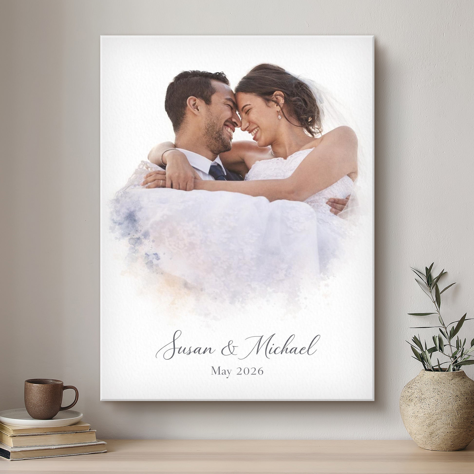 Framed wedding photo of a couple with 'Susan & Michael May 2026' text on a wall.