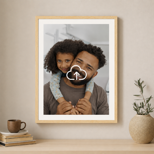 Framed photo of a man and child on a shelf with a plant and books.